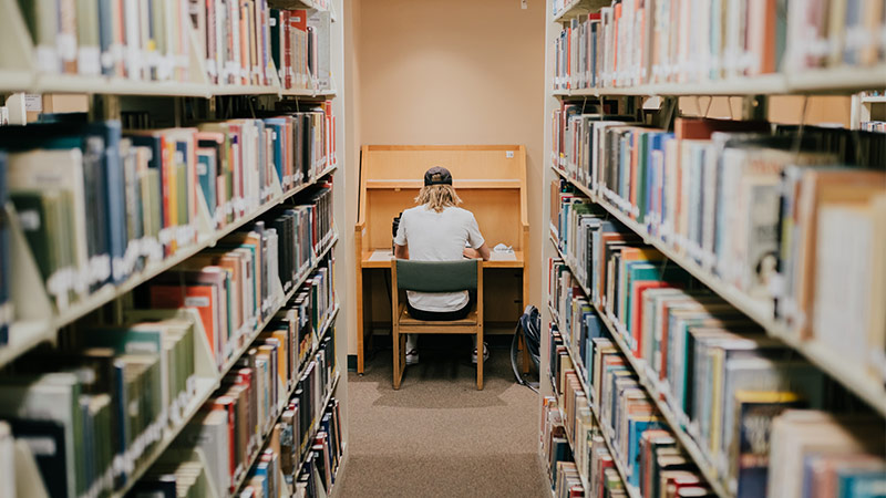 Image of student in library